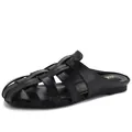 Elegant black woven flat mule shoes with hollowed caged leather design and round toe - EU 36 / Black