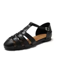 Classic black woven leather flat sandals with closed toe and adjustable T-strap buckle - EU 36 / Black