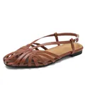 Retro brown woven hollow wedge sandals with adjustable ankle strap and flat rubber sole - EU 36 / Brown
