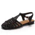 Deep brown woven leather hollow-out flat sandals with adjustable ankle strap and gold buckle - 36 / Coffee
