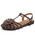 Brown flat sandals with T-strap design and large leather flower accent for women - EU 36 / Coffee