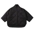 Oversized black quilted jacket with diamond patterns and a curved high-low hem design - XS / Black