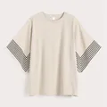 T-shirt beige a maniche a pipistrello con strisce a V nere sui polsini delle maniche - EU 38 / Bianco Sporco