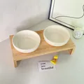 Solid white ceramic double pet bowls with a minimalist natural wood stand for cats - Double Bowls And Stand / Off White