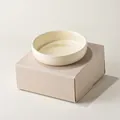 Creamy white ceramic pet bowl with a smooth glazed finish on a minimalist pedestal base - Single Bowl And Stand / Milk Yellow