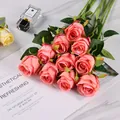 Close-up of pink artificial roses with gradient petals on a marble surface background - Deep Pink