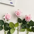 Three realistic light pink artificial roses with soft moisturizing texture and green leaves - Creamy Pink