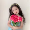 Light green thin headband with single pearl accent worn by a young girl with a rose - Deep Pink