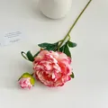 Artificial pink peony branch with a full bloom, bud and green leaves on white base - Deep Pink