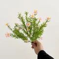 Handheld bouquet of artificial pink gypsophila flowers with green foliage and white accents - Light Pink