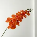 Vibrant orange-red artificial orchid branch with detailed petals for home decor - Orange