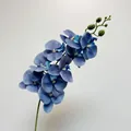 Realistic artificial 9-head orchid spray with deep blue petals and light speckles - Klein Blue