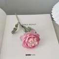 Single realistic pink artificial peony flower stem on open book for home decor - Pink Purple