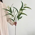 Feuilles d'eucalyptus artificielles avec petites fleurs jaunes pour décor de maison - Vert