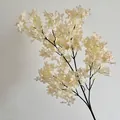 Lifelike artificial white lilac flower spray with cream petals on delicate black branch - Champagne