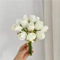 Handheld bridal bouquet featuring 12 premium white artificial roses for home decor - White
