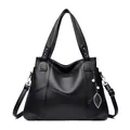 Klassische schwarze Shopper-Tasche aus Leder mit Känguru-Logo und Blattanhänger-Detail - Schwarz