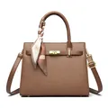 Caramel brown pebbled leather handbag with printed scarf handle and golden twist lock - Brown