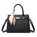 Elegant black lychee grain handbag with golden twist lock and fashion silk scarf detail - Black
