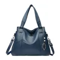 Dark blue textured leather tote bag with kangaroo logo and leaf pearl pendant - Blue