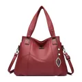 Deep red pebbled leather tote handbag with a pearl leaf pendant and shoulder strap - Red