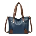 Blue lychee leather tote bag with brown handles and silver kangaroo logo detail - Blue