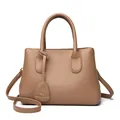 Dark brown pebble leather handbag for women featuring a minimalist geometric design - Khaki