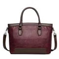 Vintage burgundy stone-textured leather handbag with brown handles and shoulder strap - Red