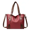 Deep red leather tote bag with dark brown handles and brand logo in variant view - Red