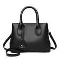 Classic black lychee pattern leather handbag with adjustable strap and kangaroo pendant - Black