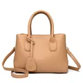 Elegant camel lychee leather handbag with kangaroo pendant and adjustable shoulder strap - Biscuit