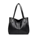 Sleek black leather tote bag with glossy finish and silver Z-shaped metallic hardware - Black