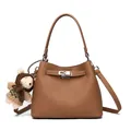 Caramel brown pebbled leather bucket bag with silver lock and cute bear charm - Yellow Brown