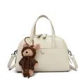 Cream white lychee leather Boston bag with handles and a cute brown plush bear charm - Off White