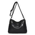 Minimalist black washed leather crossbody bag with multiple zip pockets and adjustable strap - Black
