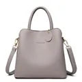 Medium gray pebble leather bucket bag with top handle and detachable shoulder strap - Gray