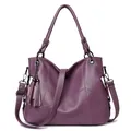 Elegant purple pebbled leather handbag with V-shaped stitching and side tassel detail - Purple