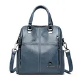 Blue quilted sheepskin leather backpack featuring a gold kangaroo logo and cross stitching - Blue