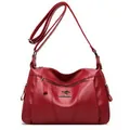Deep red lychee texture crossbody bag with gold kangaroo logo and adjustable strap - Dark Red
