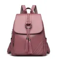 Pink faux leather backpack with woven strap, metal ring, and double tassel detail - Purple