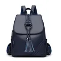Dark blue leather backpack with tassel pendant and woven texture for women - Blue