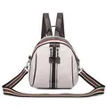 Mini shell-shaped cream white backpack with brown leather trim and striped shoulder strap - White