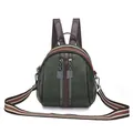 Dark green shell backpack with textured leather and striped multicolored shoulder strap - Green