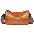 Brown leather cylinder barrel bag with vintage patterned strap and white stitching - Brown