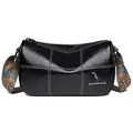 Black leather barrel bag with contrast stitching and colorful ethnic fabric shoulder strap - Black