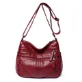 Dark red washed faux leather crossbody bag with multiple zippers and adjustable strap - Red