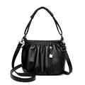 Bolso tipo cubo de cuero suave negro para mujer con textura plisada y correas dobles - Negro