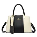 Schicke schwarz-weiße Känguru-Lederhandtasche mit Goldlogo für moderne Frauen - Weißschwarz