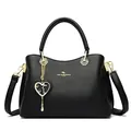 Elegant black leather handbag with litchi texture, golden logo and heart charm detail - Black