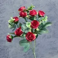 Artificial bouquet of ten red rose buds with green eucalyptus leaves on dark fabric - Red
